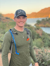 Load image into Gallery viewer, Luke Eggebraaten wearing the 1st Edition PM hat on a hike