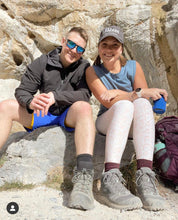 Load image into Gallery viewer, Lindsey and Dan hiking in the mountains! Lindsey is sporting our 2nd Edition Phaser Marketing hat!