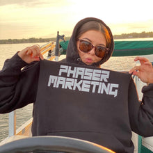 Load image into Gallery viewer, Lily Olson sporting her Phaser Marketing sweatshirt out on Detroit Lake