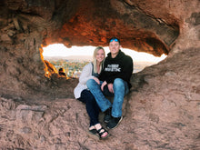 Load image into Gallery viewer, Caleb and Katie exploring on a hike while Caleb is wearing our Black Phaser Marketing Sweatshirt