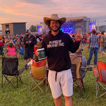 Load image into Gallery viewer, Justin Leonard wearing his Phaser Marketing sweatshirt at a country concert