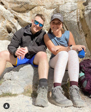 Load image into Gallery viewer, Lindsey and Dan hiking in the mountains! Lindsey is sporting our 2nd Edition Phaser Marketing hat!
