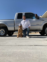 Load image into Gallery viewer, Jacob and his dog posing next to his truck.
