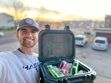 Load image into Gallery viewer, Clay was our Phaser Friday winner and is posing with his new Yeti, La Croix and wearing a 3rd edition patch hat as well as our Phaser Space Crew
