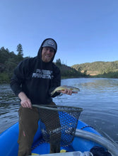 Load image into Gallery viewer, Hayden Sheeran wearing his Phaser Marketing sweatshirt while out fishing
