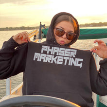 Load image into Gallery viewer, Lily Olson sporting her Phaser Marketing sweatshirt out on Detroit Lake
